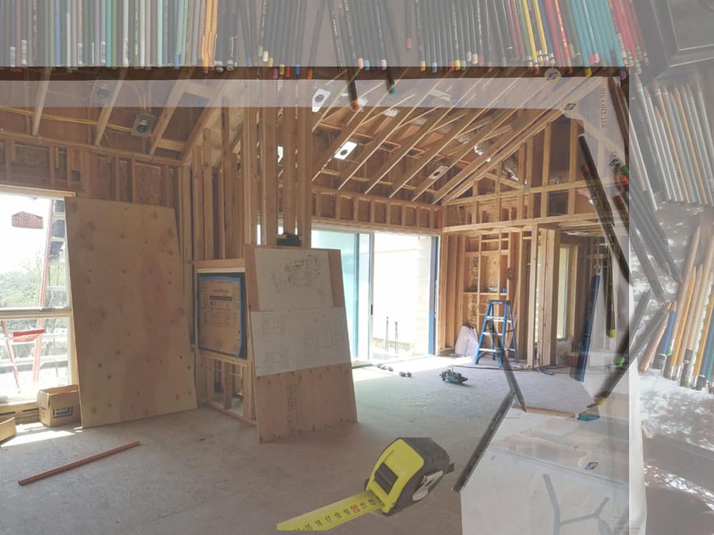 Designers table with pencils, construction photo and measuring tape